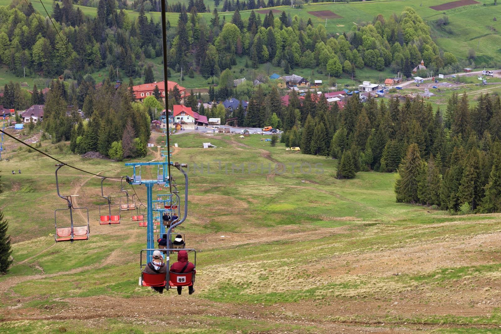 Mountain lift carries people into the valley to the village and the foot of the mountain. by Sergii