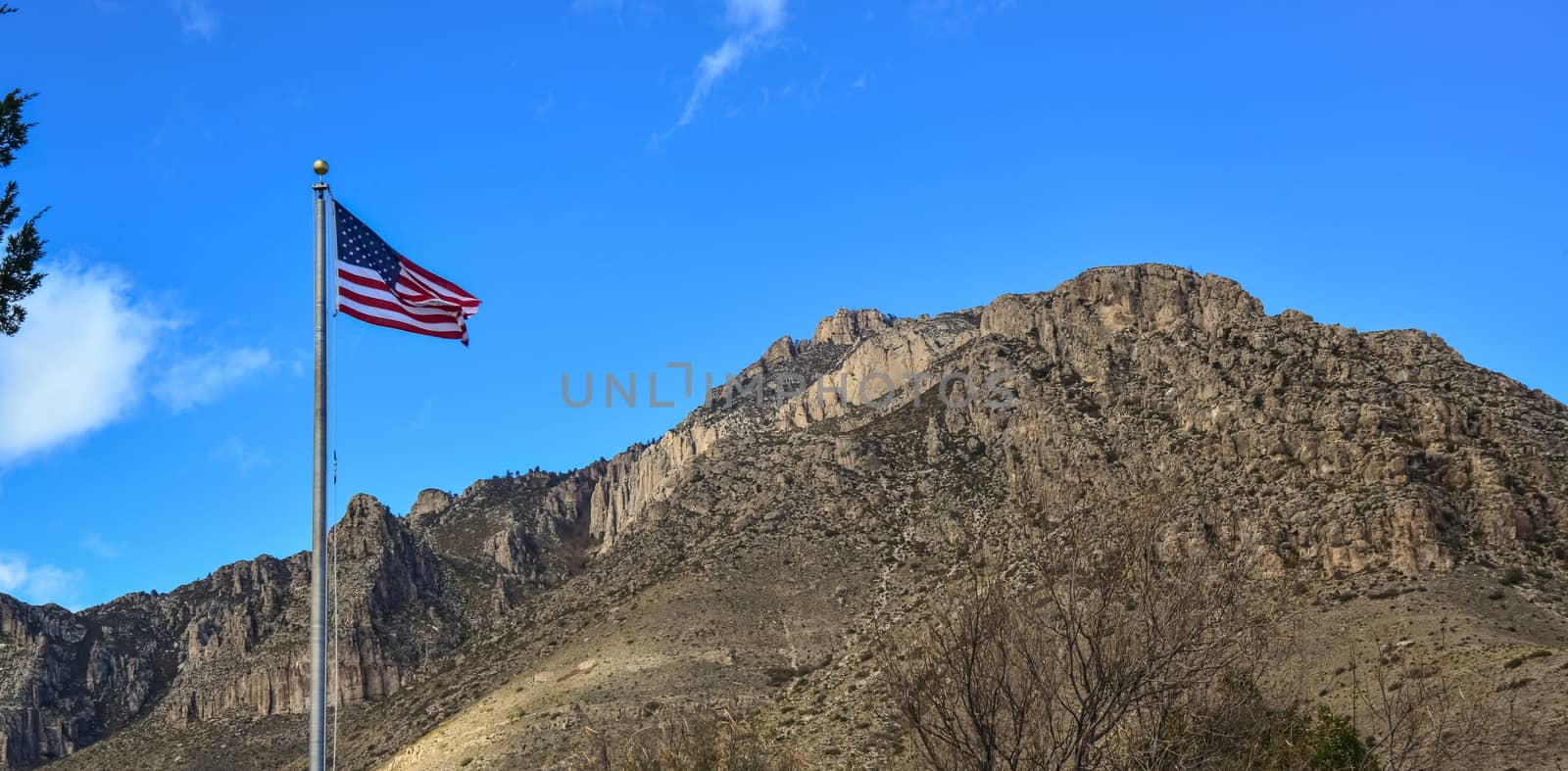 NEW MEXICO, USA - NOVEMBER 22, 2019: American flag against a blue sky in the territory of a visit center in a park in New Mexico