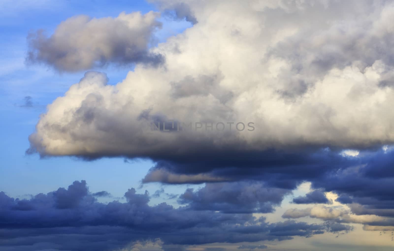 Thunderclouds float in the sky, gathering together.