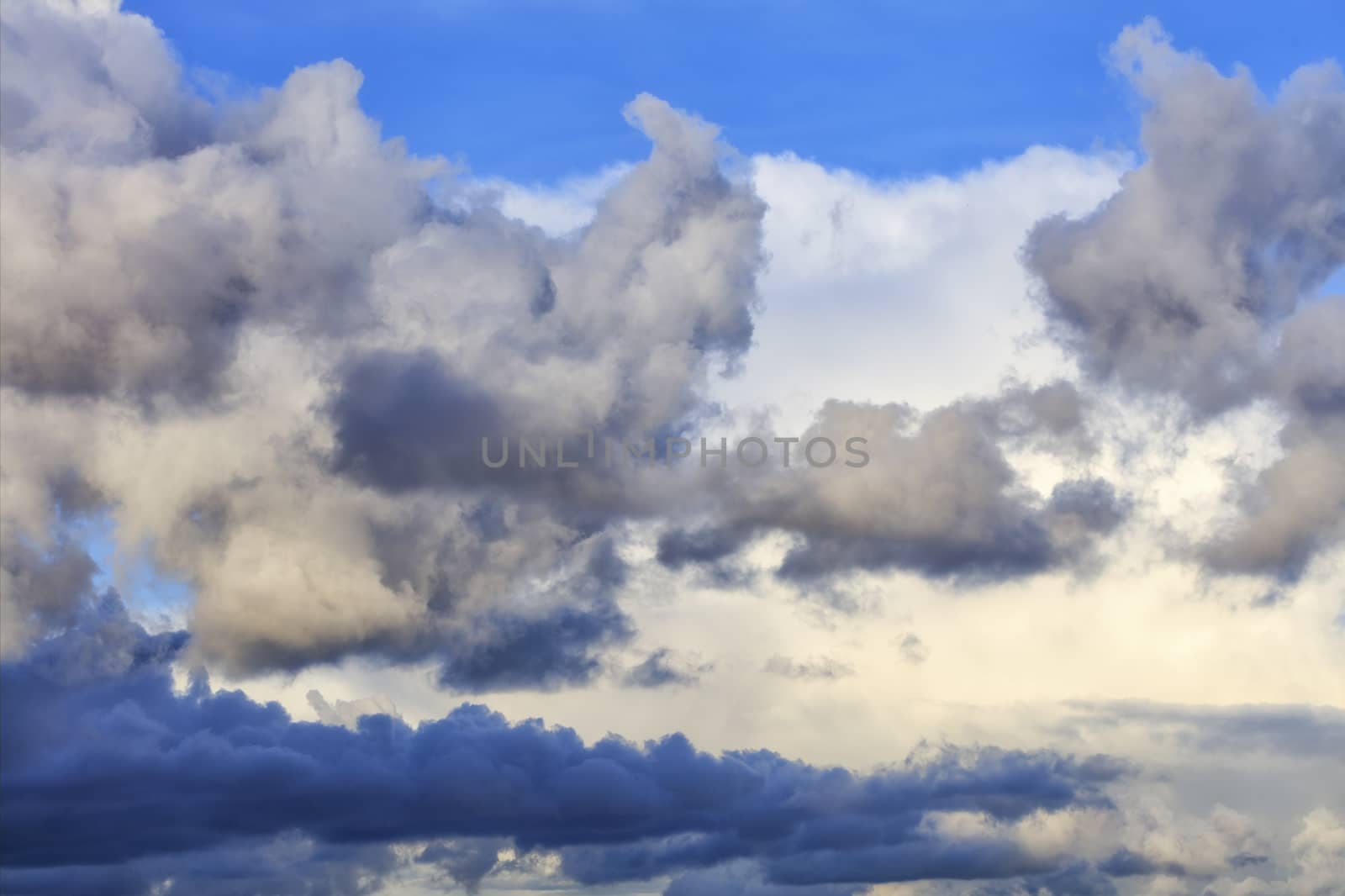 Thunderclouds float in the sky, gathering together.