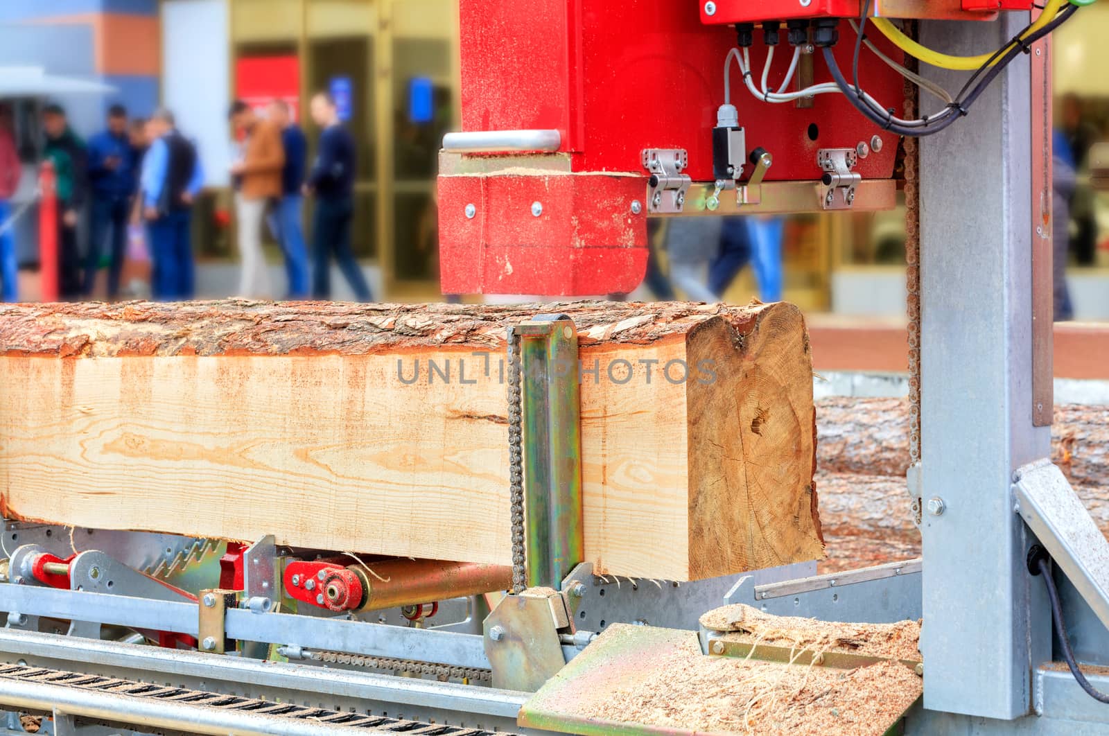 Modern woodworking technology, automatic sawmill, close-up, background in blur.