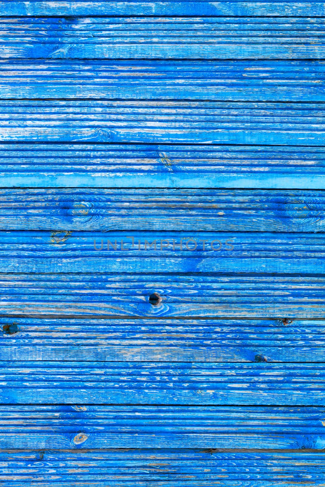 Classic light blue color of old paint on a weathered shabby wooden surface, texture of old wood. by Sergii