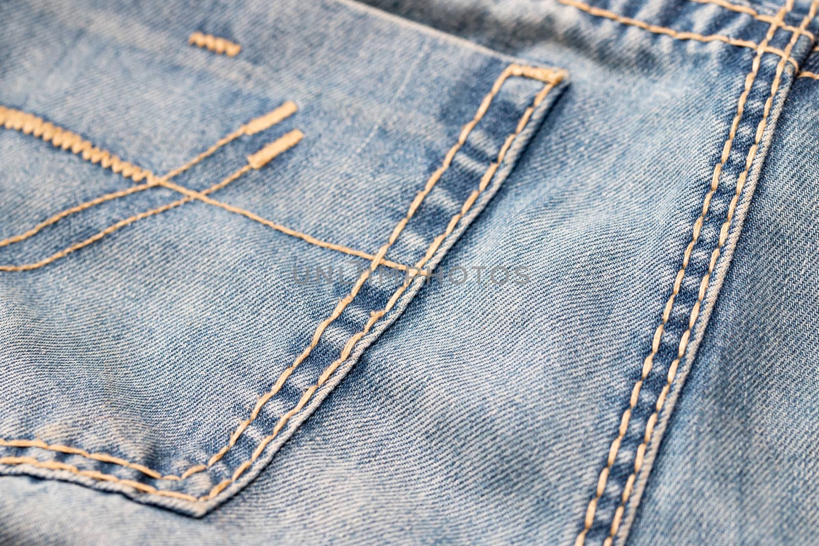 Close-up of blue denim texture. Denim jeans background by bonilook