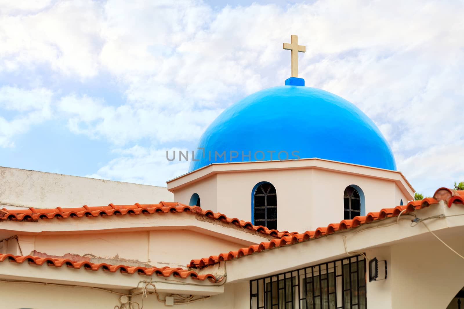 The blue dome of ritual bell tower of the Orthodox Church of Ekklisia Agios Ioannis in Loutraki, August 15, 2019, Greece.