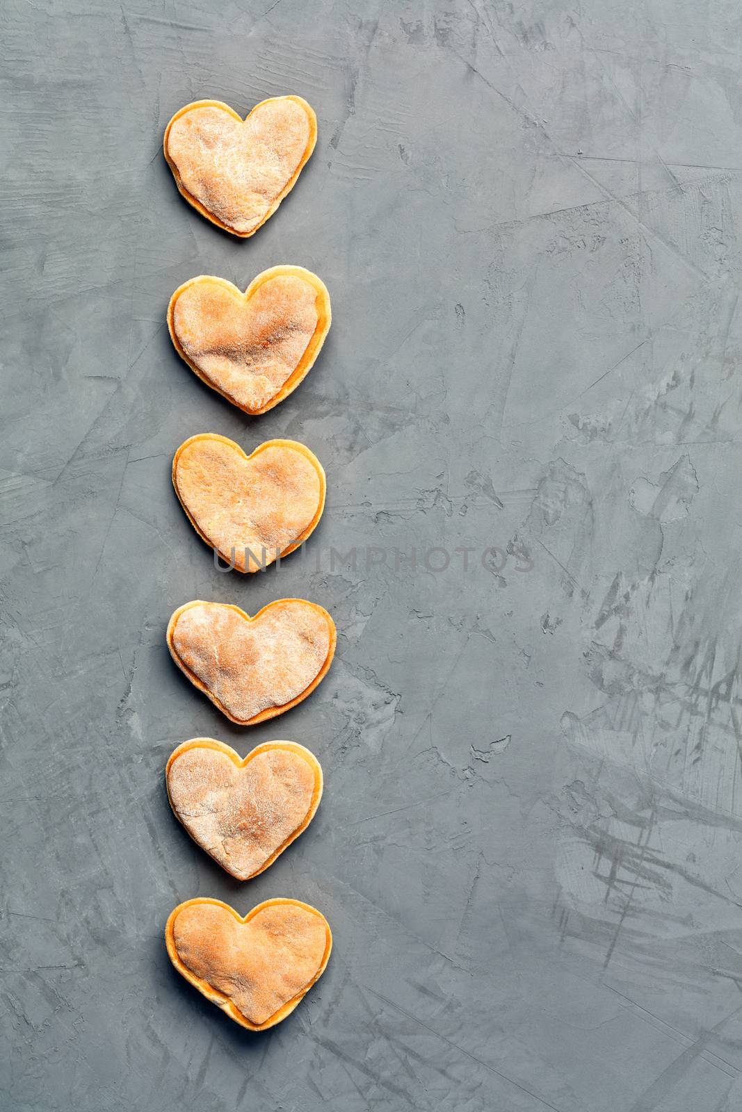 Delicious homemade ginger shortbread gingerbread cookie on a gray concrete surface. by Sergii