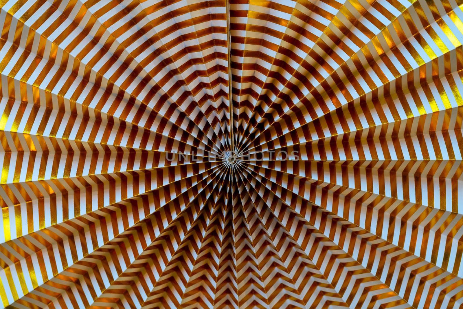 Abstract golden background. Lines from the center. Corrugated paper background.