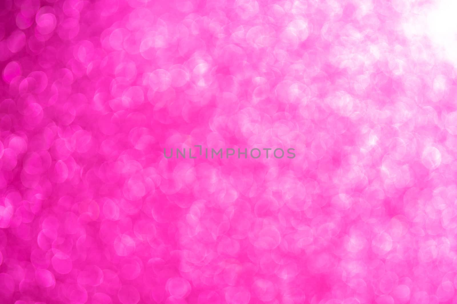 Pink Abstract beautiful bokeh background. Uneven dynamic background of the light effect of the lens.