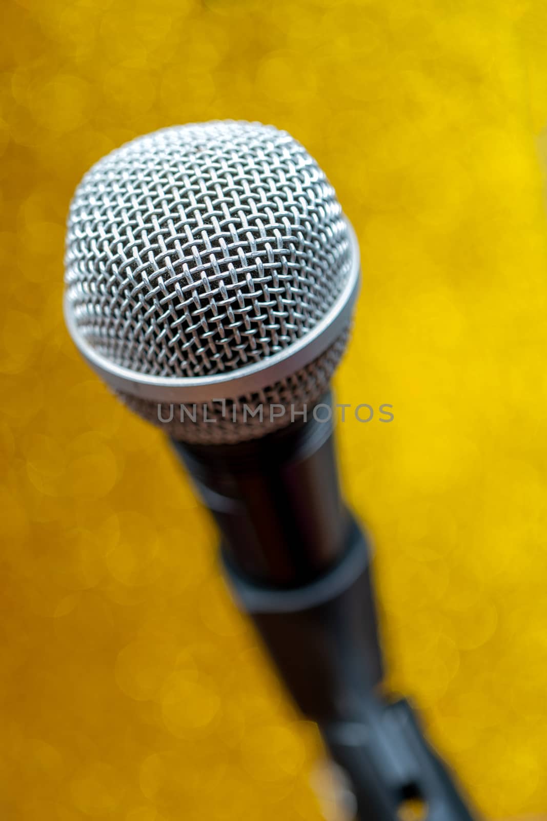 Professional dynamic microphone. Concert microphone for voice recording and sound enhancement. Sound equipment.