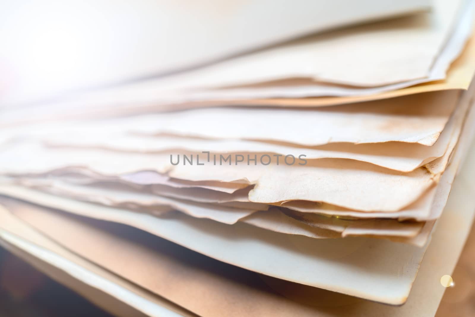 Stack of vintage paper. Old yellow sheets of paper. Yellow pages of the book.