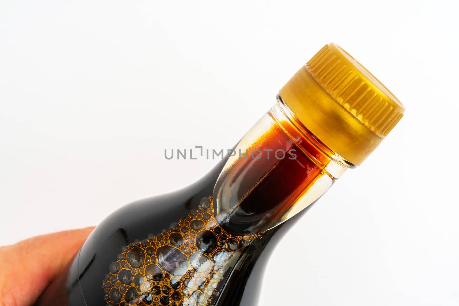 Soy sauce in glass bottle. Traditional asian seasoning.