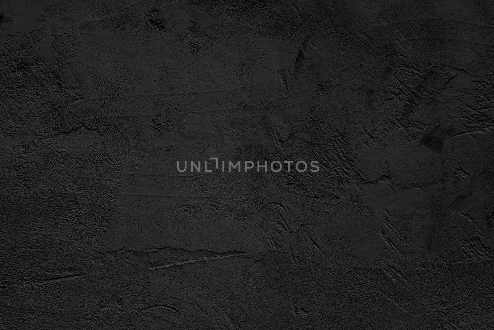 Black abstract background. Black stucco wall of an old house.