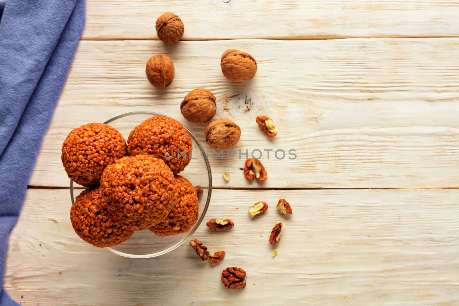 Homemade energy balls with walnuts, peanut, honey and banana. Vegan Vegetarian Raw Snacks. Healthy Sweet Food. Copy space. Flat lay, top view.
