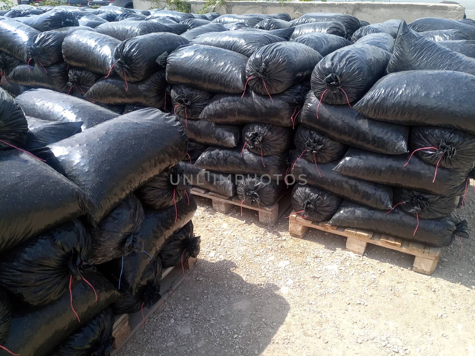 Packages with rubble and sand on the construction site. Building materials base.