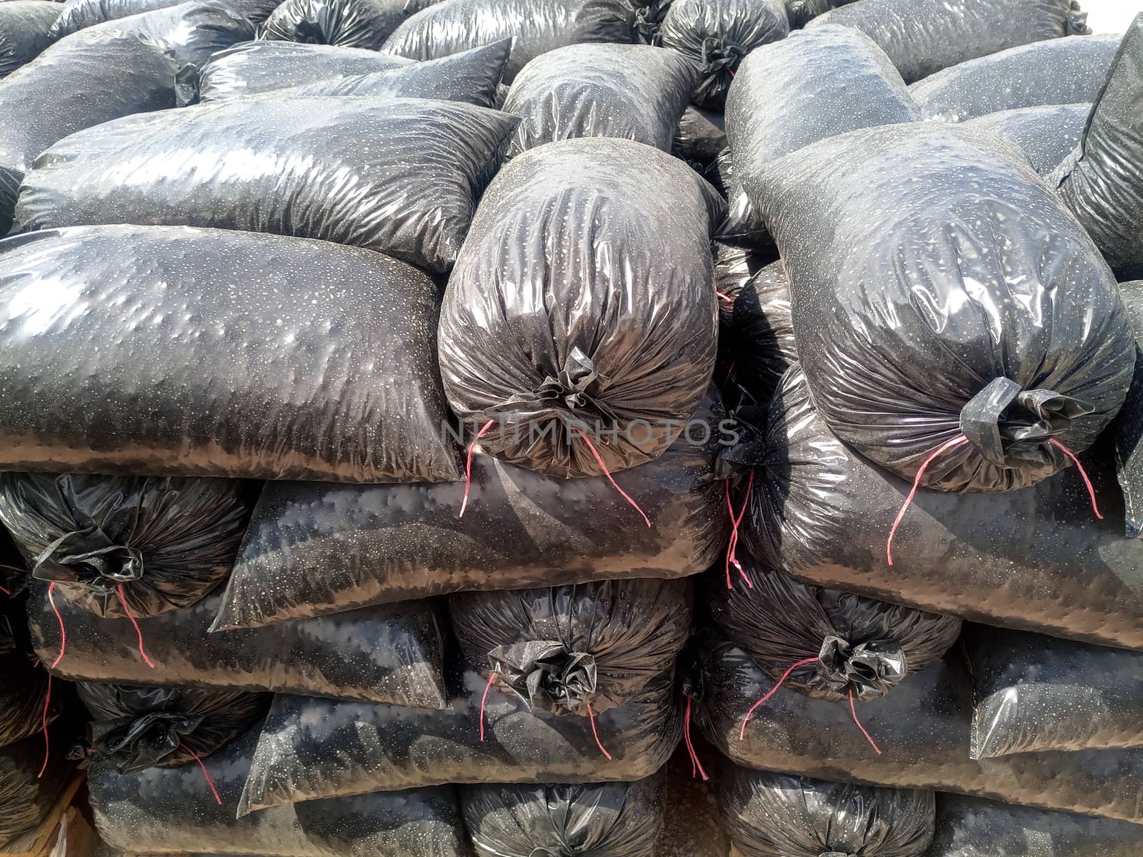 Packages with rubble and sand on the construction site. Building materials base.