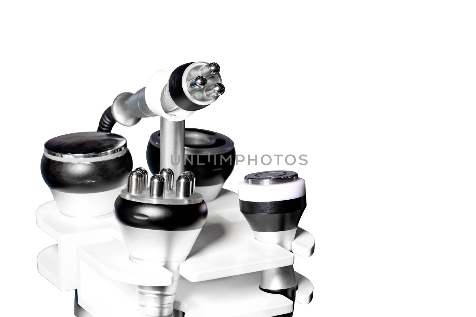 Various tools of a medical cosmetology apparatus for liposuction and massage are used to correct a person s figure, close-up, isolated on a white background.