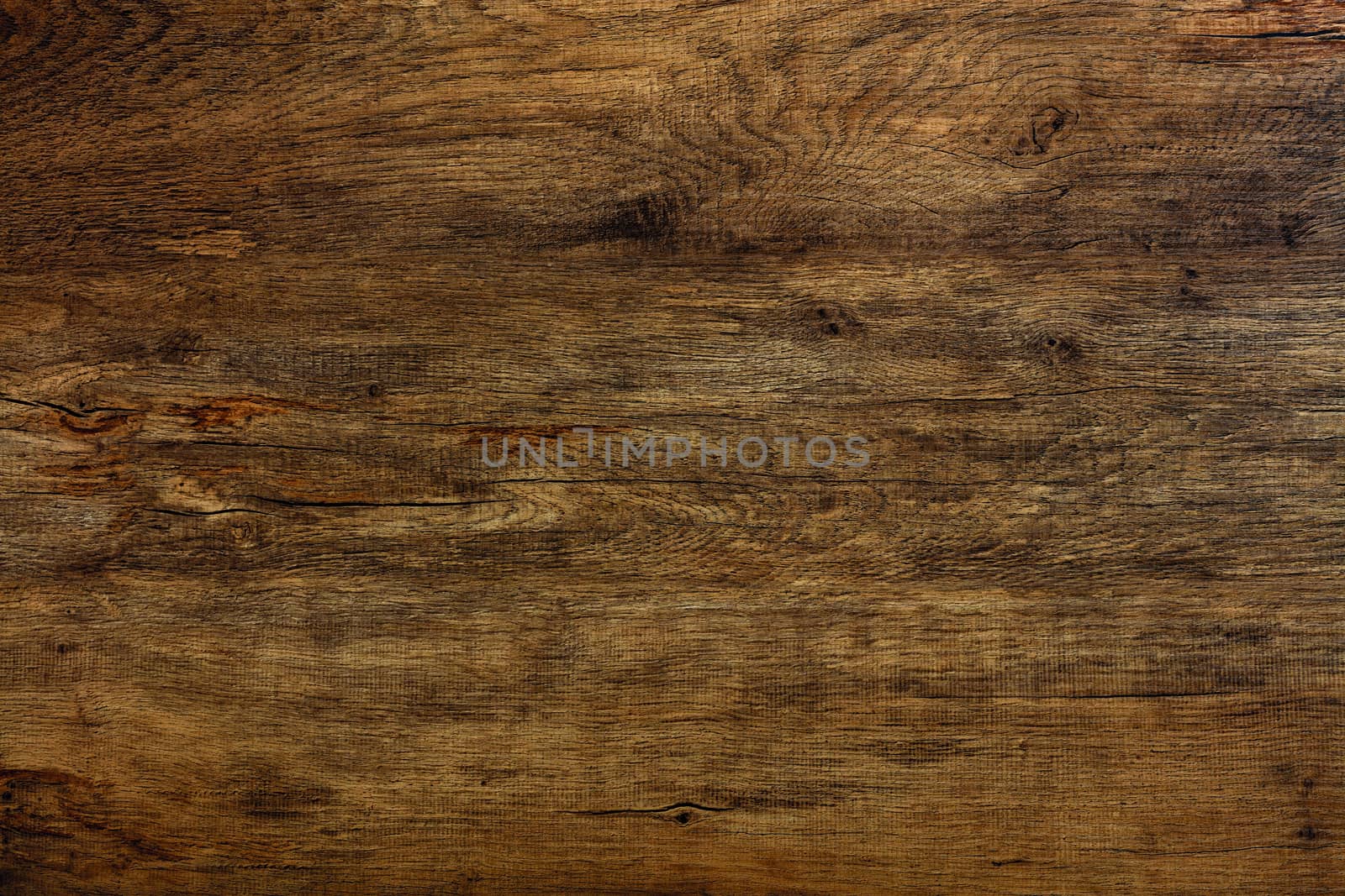 A beautiful pattern of old wood fibers oak with cracks, spots with horizontal waveforms.