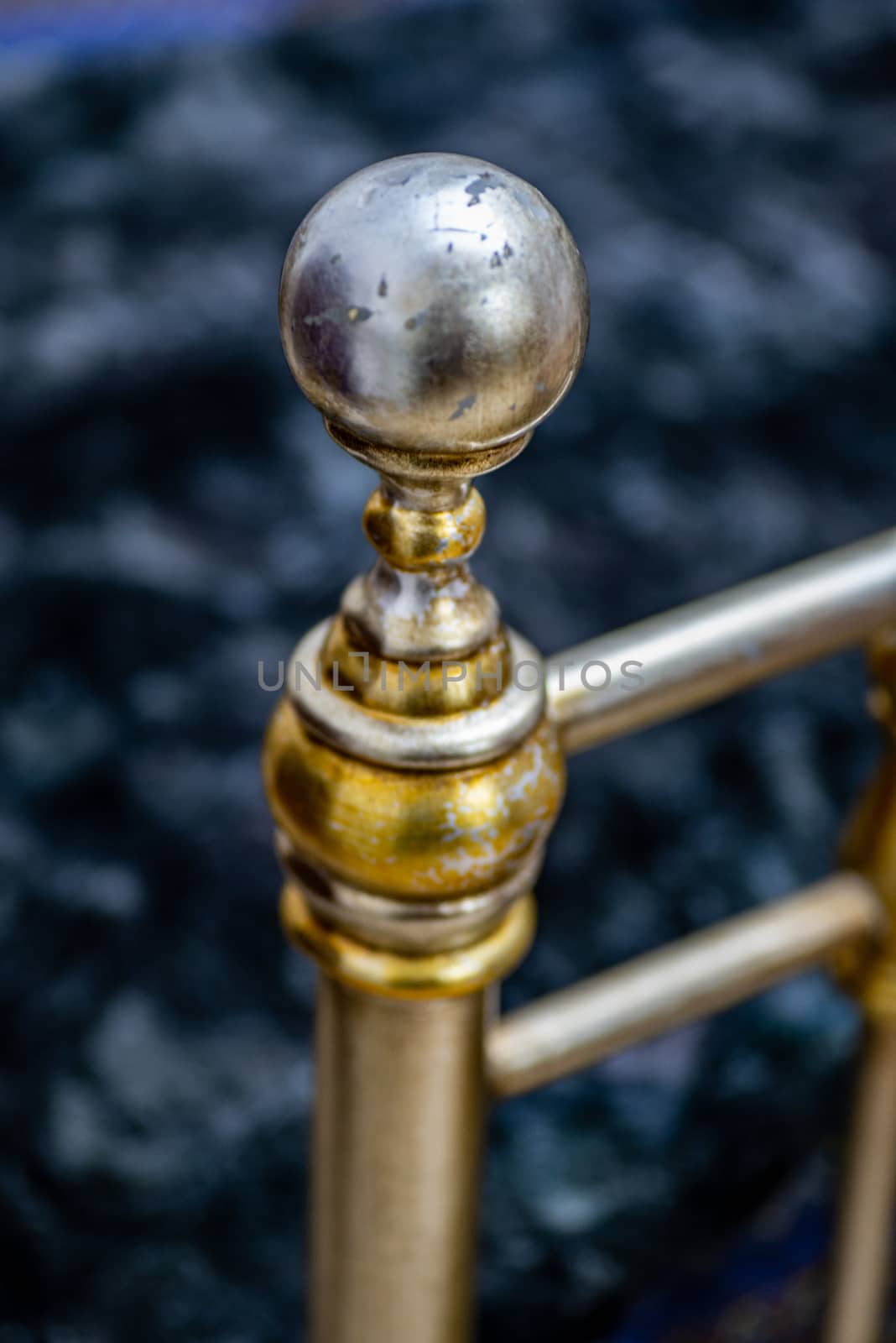 DETAIL OF ANTIQUE STYLE WROUGHT IRON KNOB SELECTIVE FOCUS