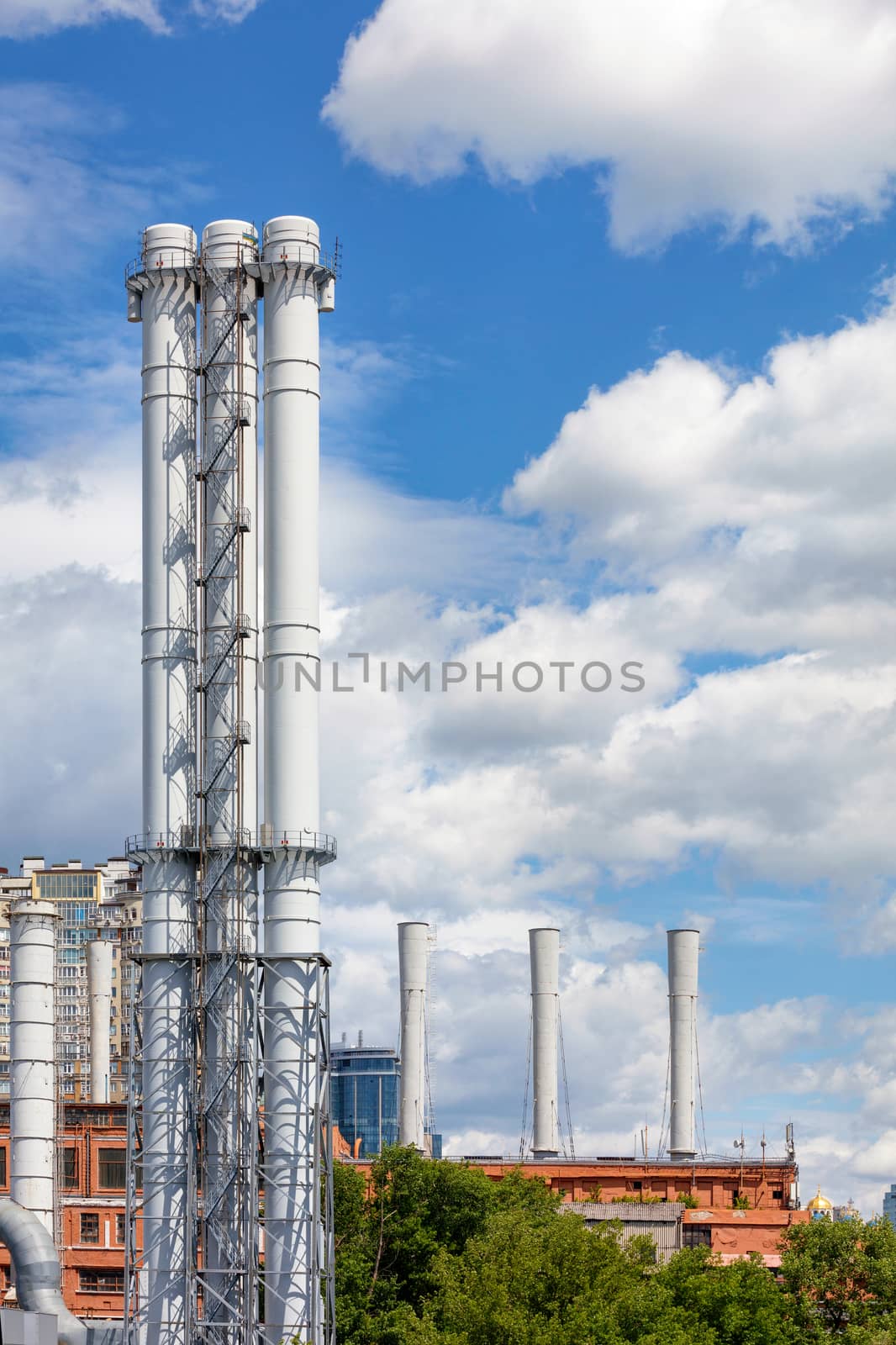 Industrial pipes without air pollution, the chimneys without of any smoke and dirty in cityscape.