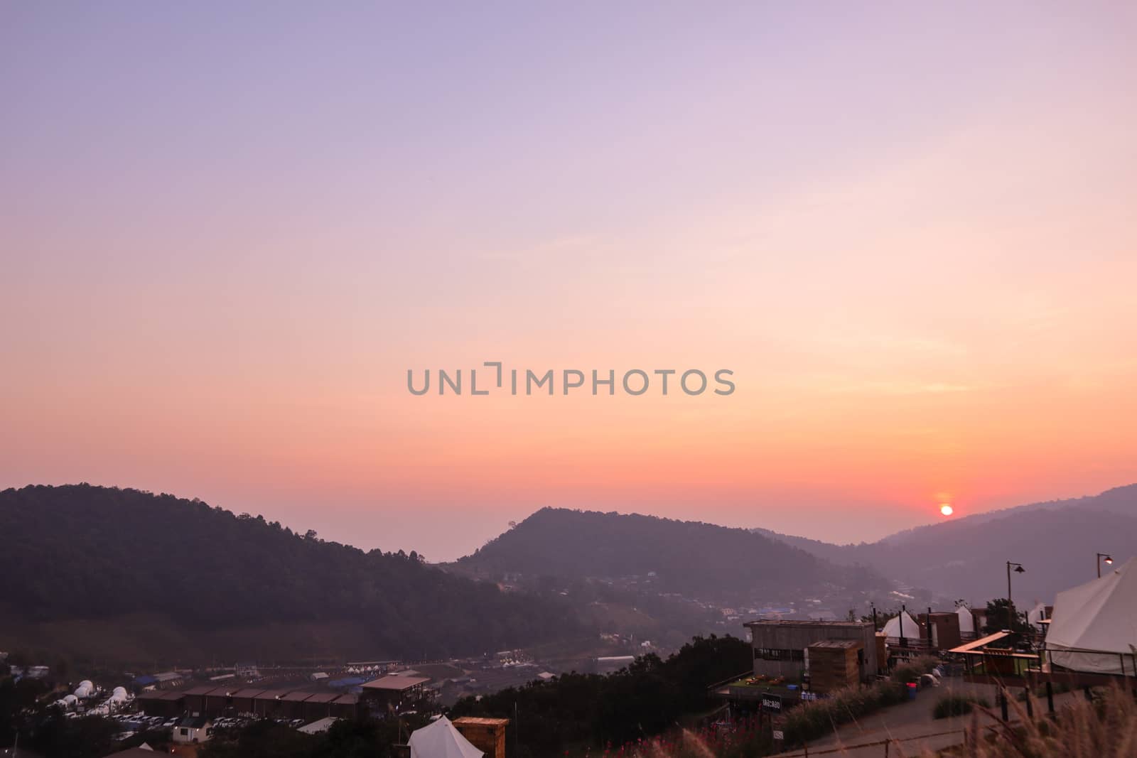 Colorful sunset over the mountain hills in a thai village near mountains in Chiang Mai, Thailand. The mountain scenery view