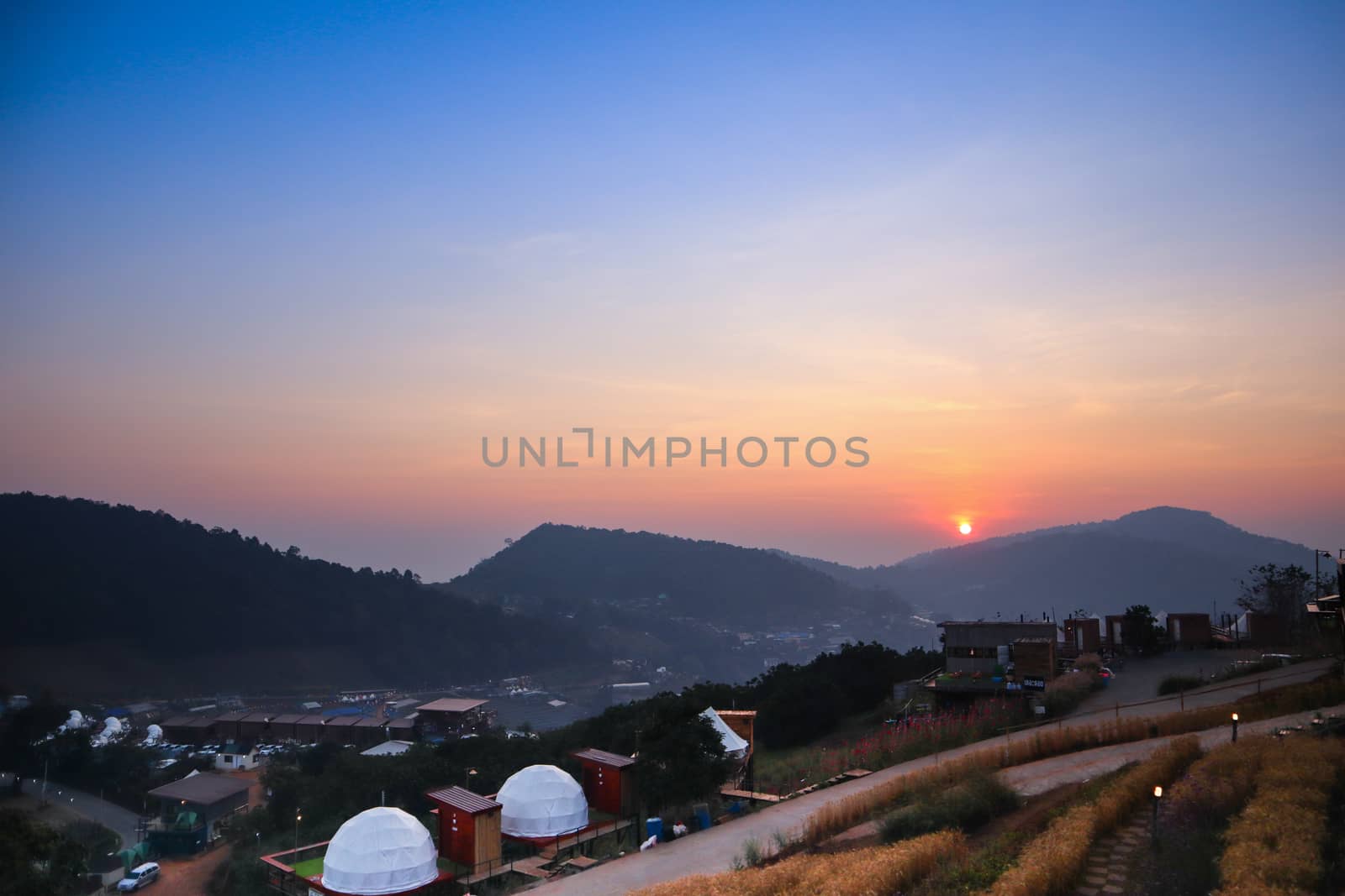 Colorful sunset over the mountain hills in a thai village near mountains in Chiang Mai, Thailand. The mountain scenery view