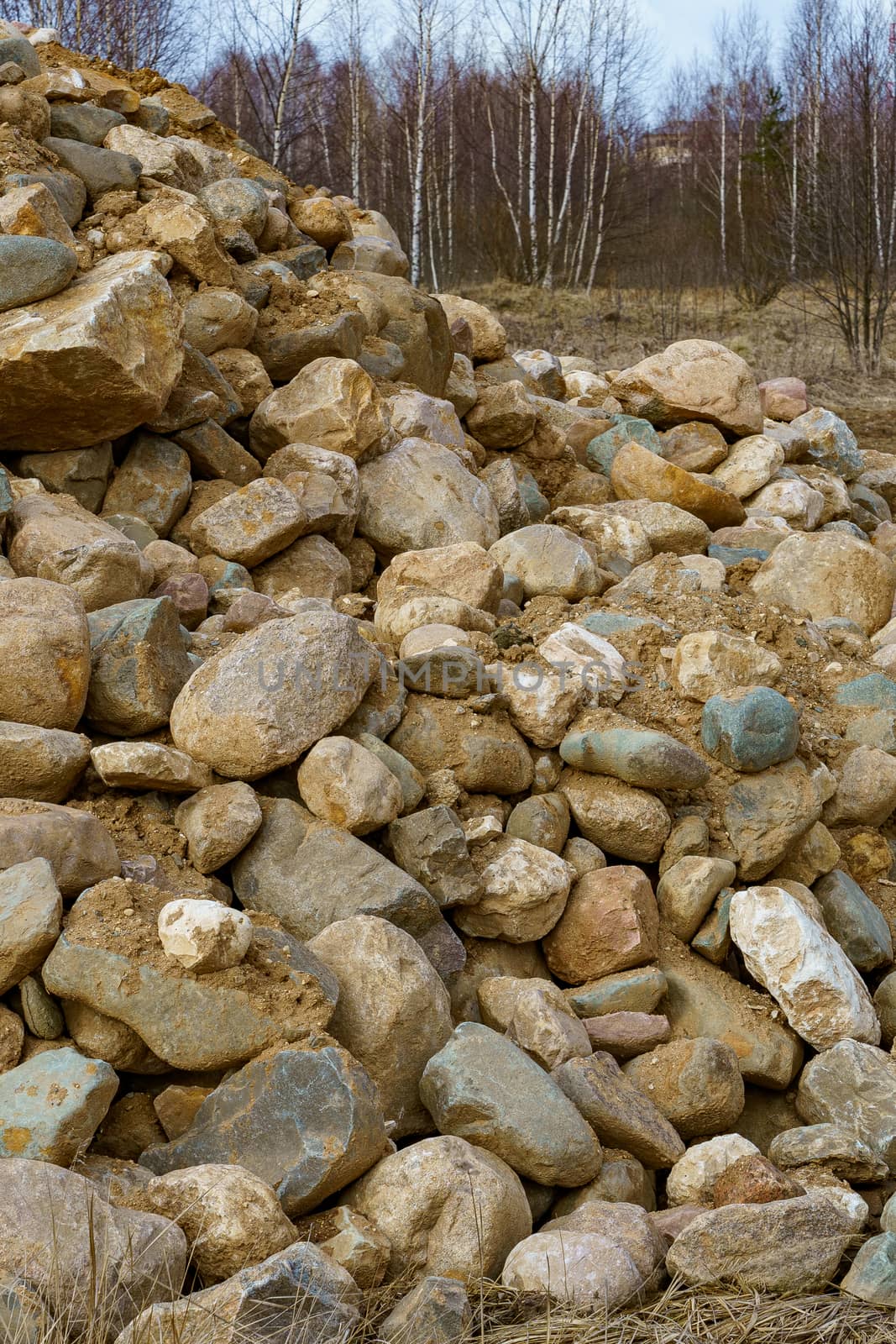 pile of cobblestones with sand prepared for construction by VADIM