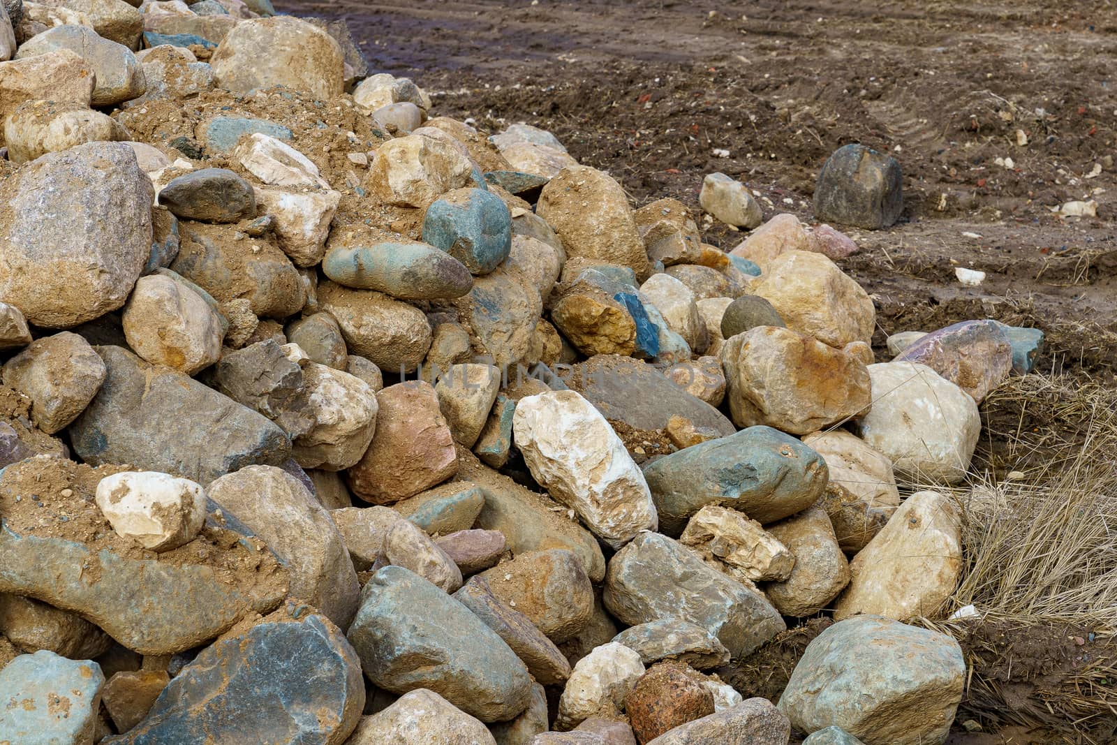 pile of cobblestones with sand prepared for construction