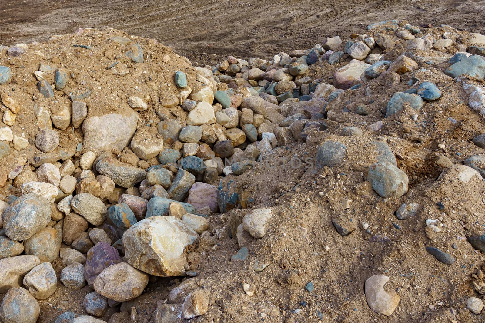 pile of cobblestones with sand prepared for construction