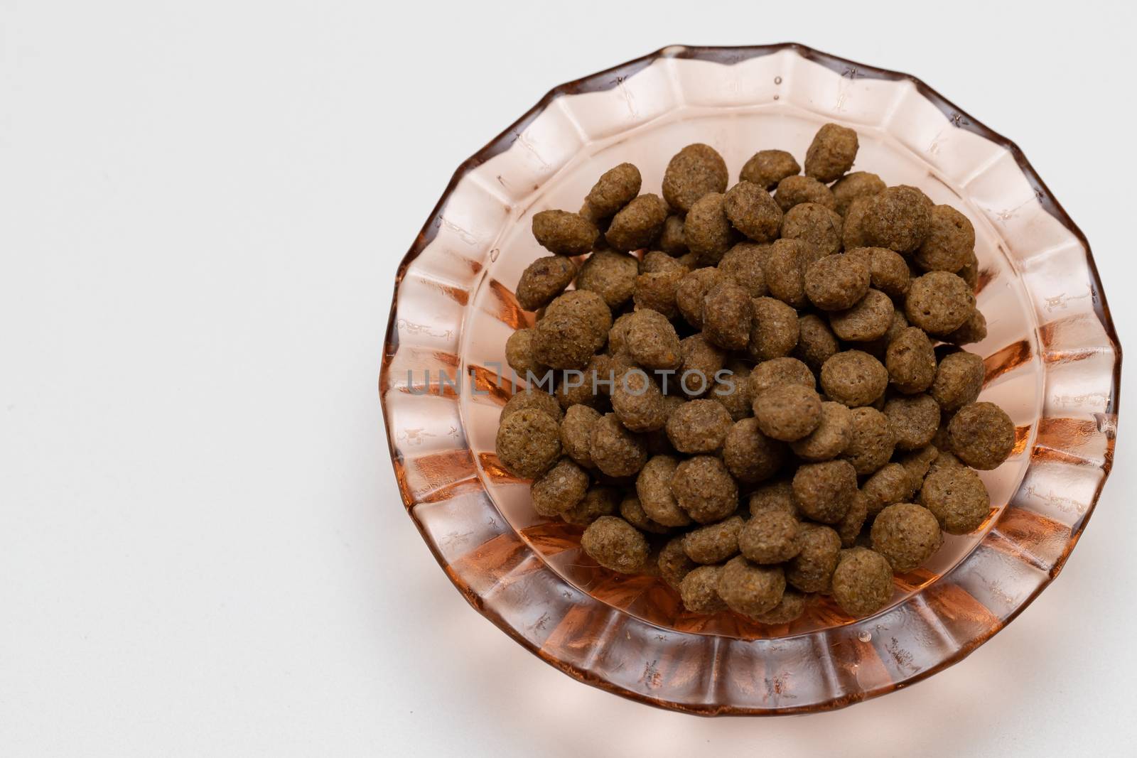 Balls of cat food in a beautiful bowl on a white background by bonilook