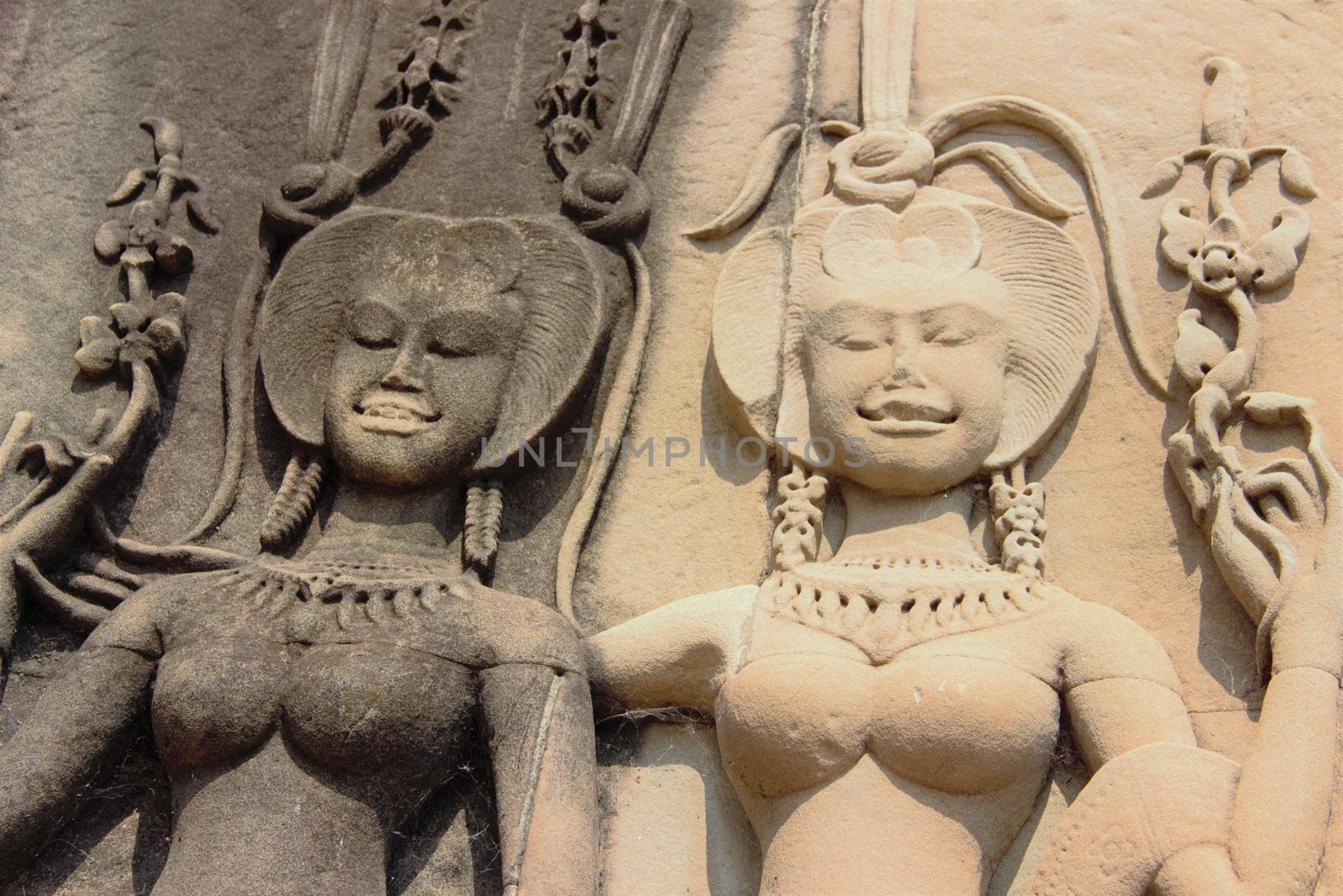 Apsara dancer girl dancing carving in stone at angkor wat temple cambodia siem reap siam