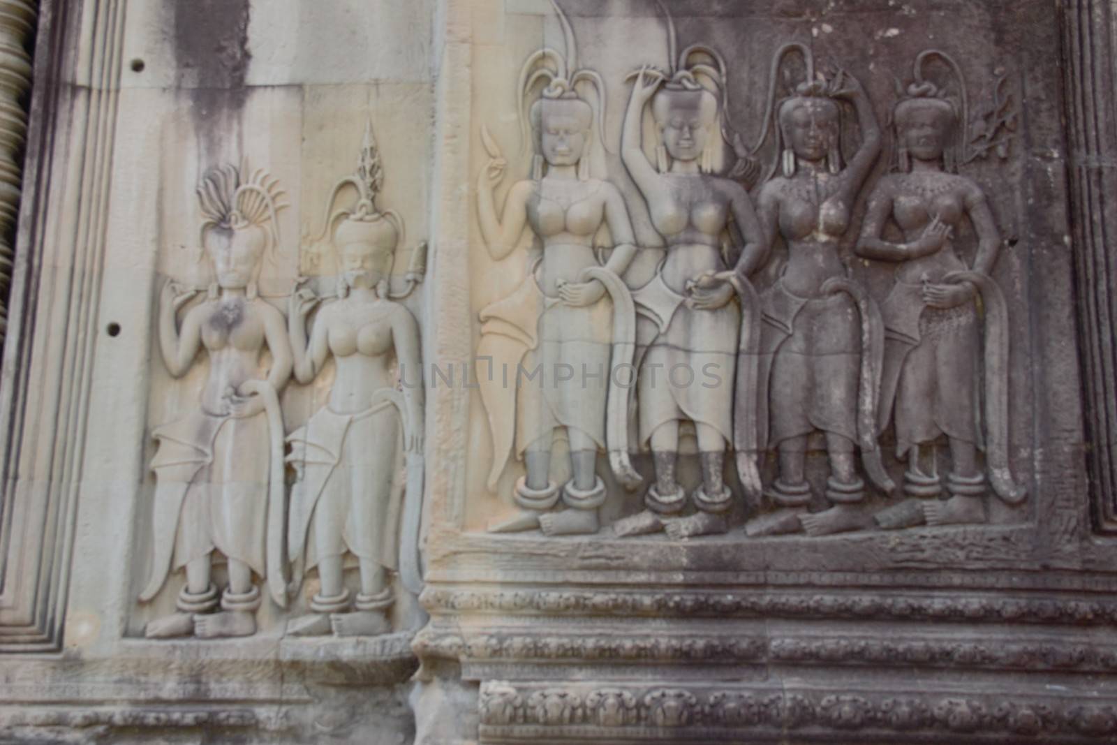 Apsara dancer girl dancing carving in stone at angkor wat temple cambodia siem reap siam