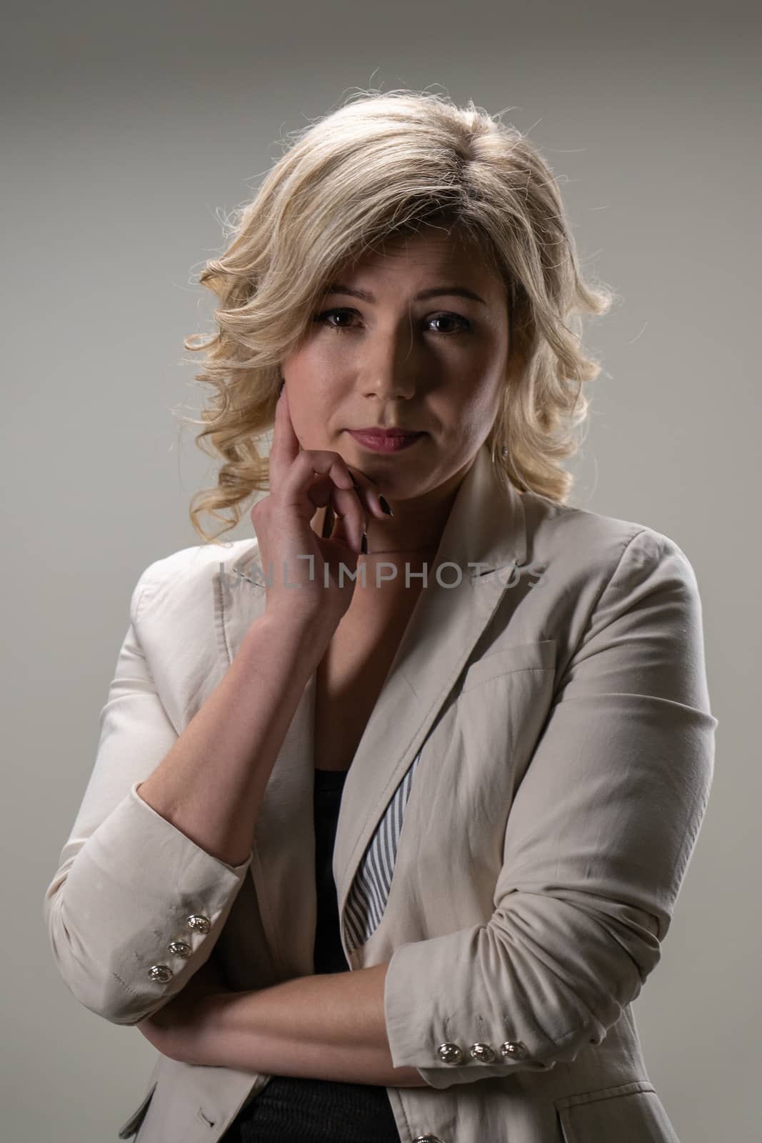 30 years old woman with blond hair in business clothes posing  by VADIM