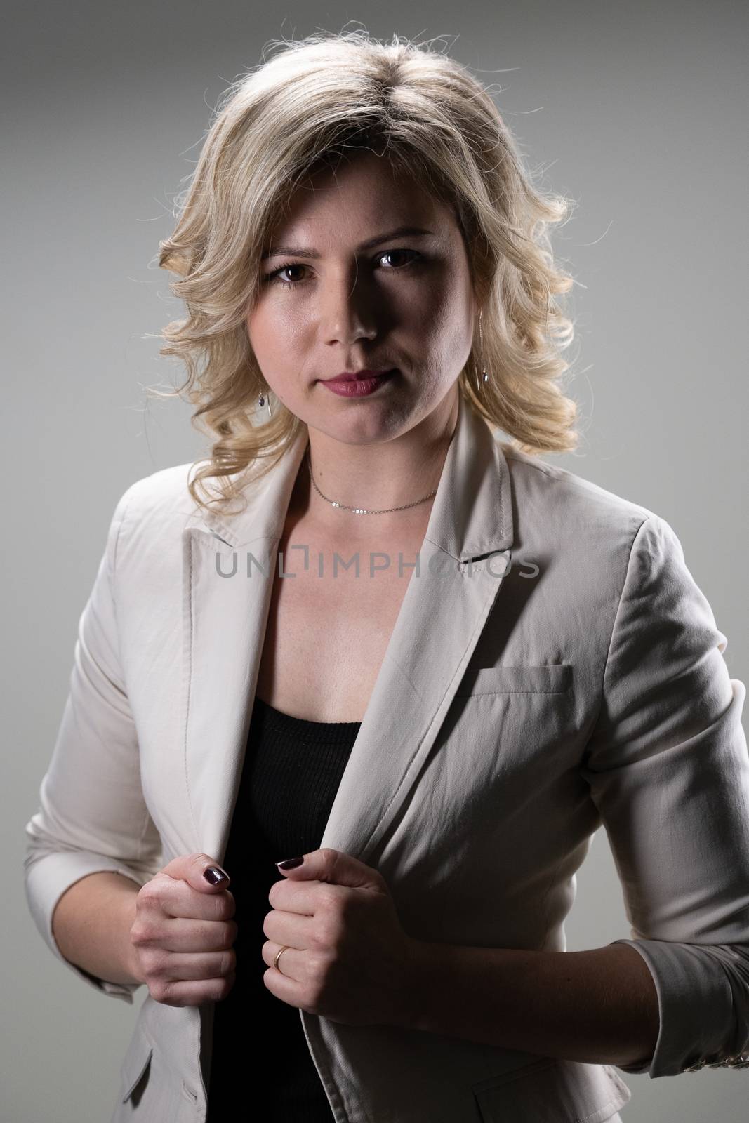 30 years old woman with blond hair in business clothes posing  by VADIM