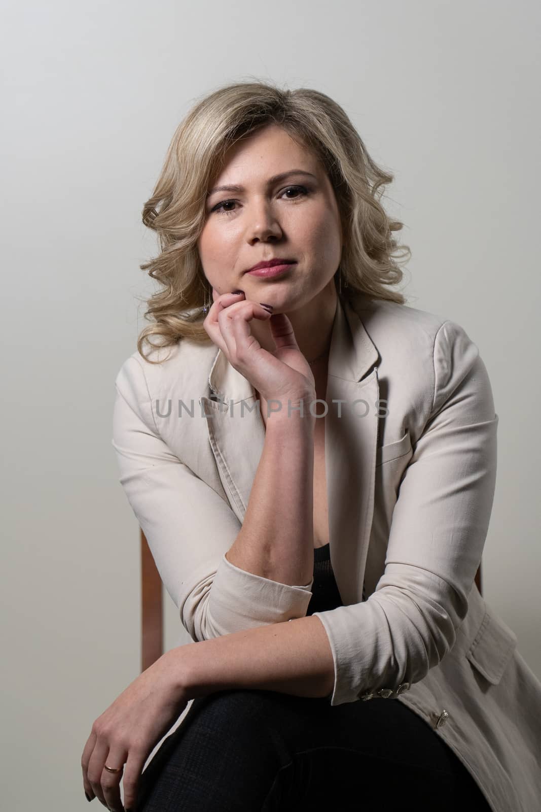woman with blond hair posing on a white background by VADIM