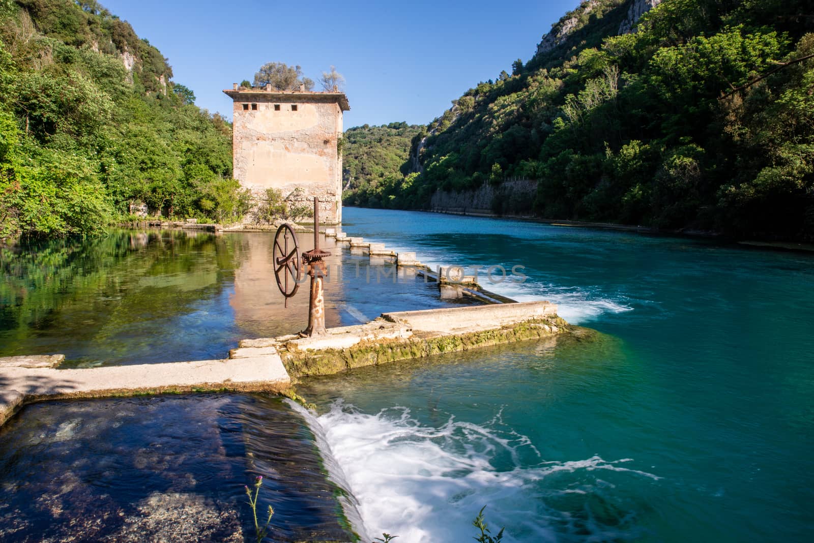 bulk of the country of a blue-watered siphon where boys bathe in the summer