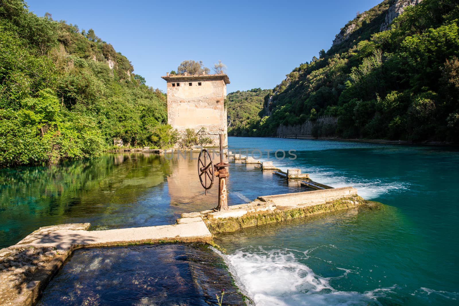 bulk of the country of a blue-watered siphon where boys bathe in the summer