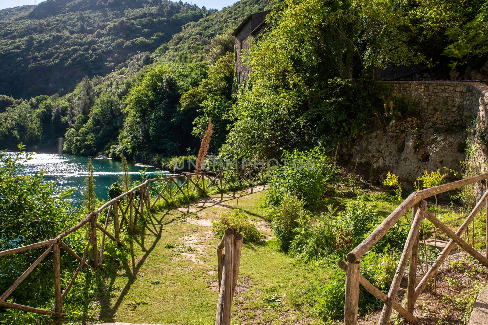 small stifone garden on the river with blue water