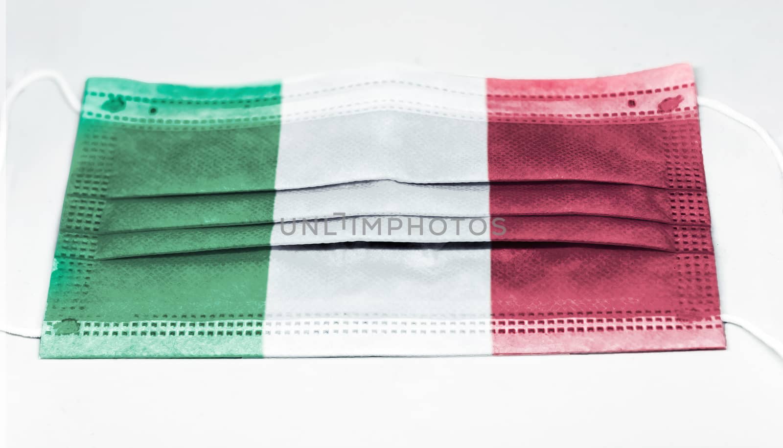 surgical mask with the national flag of Italy printed. Pandemic covid-19 and preventive measures to counter the spread of the virus