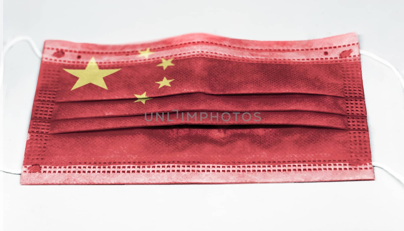 surgical mask with the national flag of China printed. Pandemic covid-19 and preventive measures to counter the spread of the virus