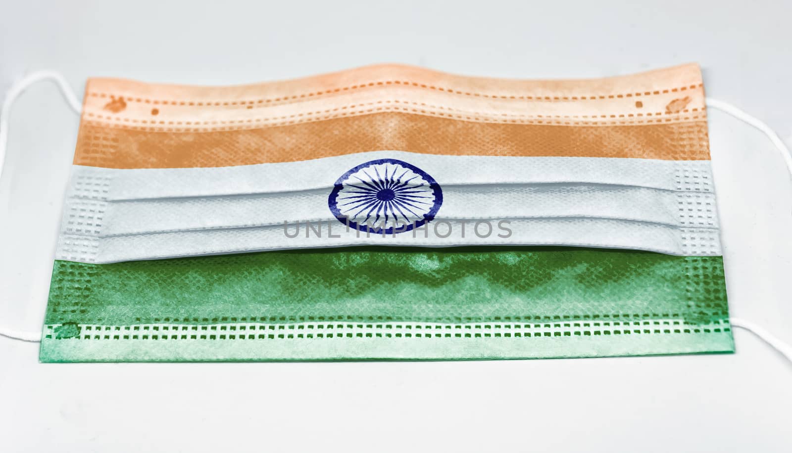 surgical mask with the national flag of India printed. Pandemic covid-19 and preventive measures to counter the spread of the virus