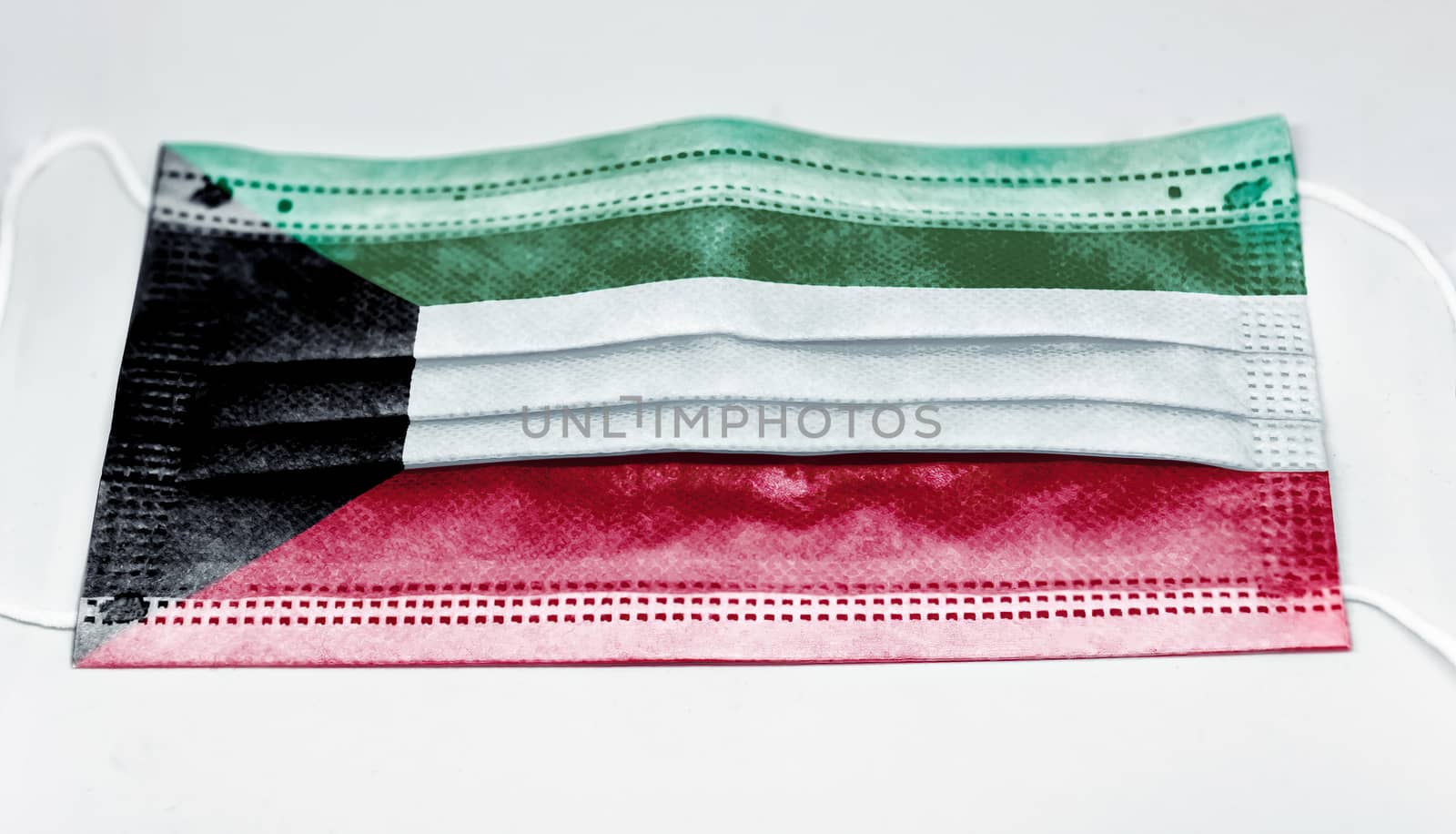 surgical mask with the national flag of Kuwait printed. Pandemic covid-19 and preventive measures to counter the spread of the virus