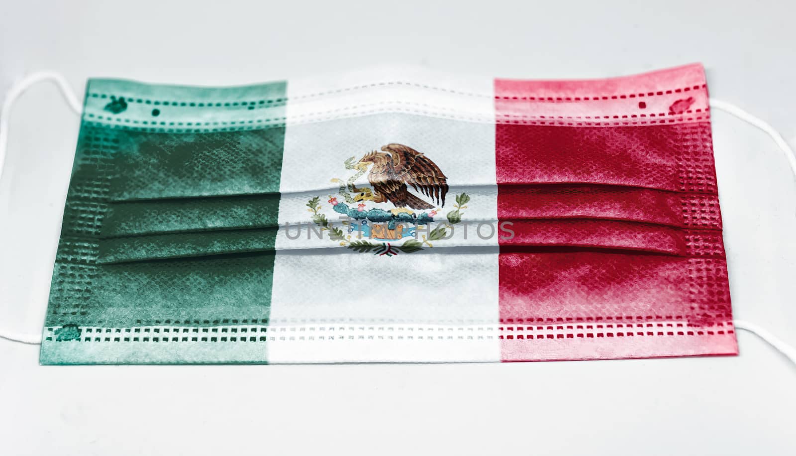 surgical mask with the national flag of Mexico printed. Pandemic covid-19 and preventive measures to counter the spread of the virus