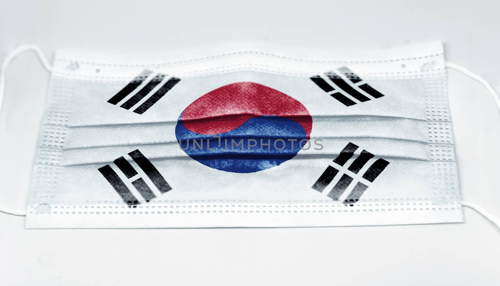surgical mask with the national flag of South Korea printed. Pandemic covid-19 and preventive measures to counter the spread of the virus
