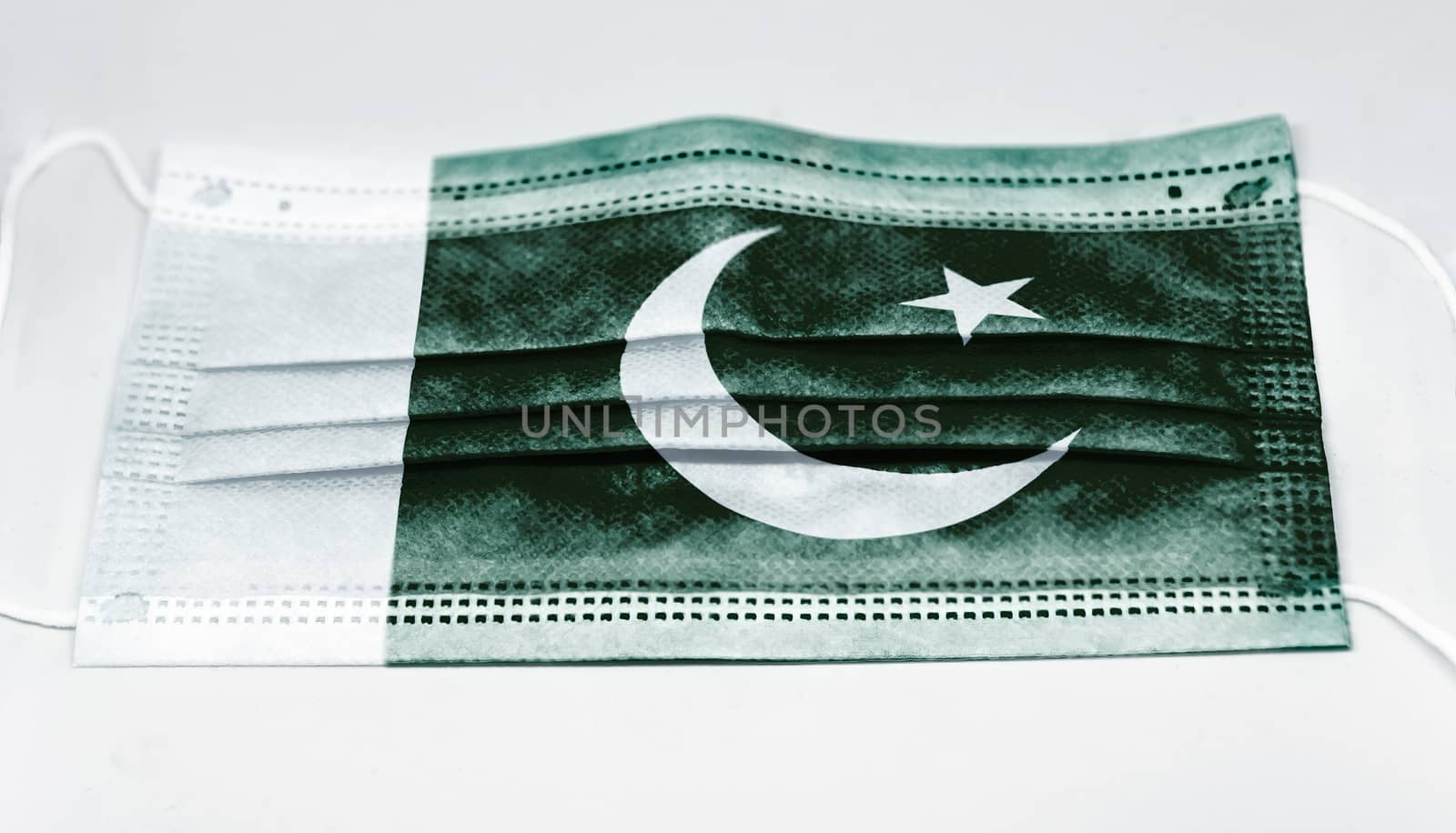 surgical mask with the national flag of Pakistan printed. Pandemic covid-19 and preventive measures to counter the spread of the virus