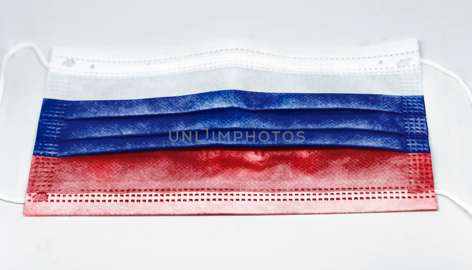 surgical mask with the national flag of Russia printed. Pandemic covid-19 and preventive measures to counter the spread of the virus