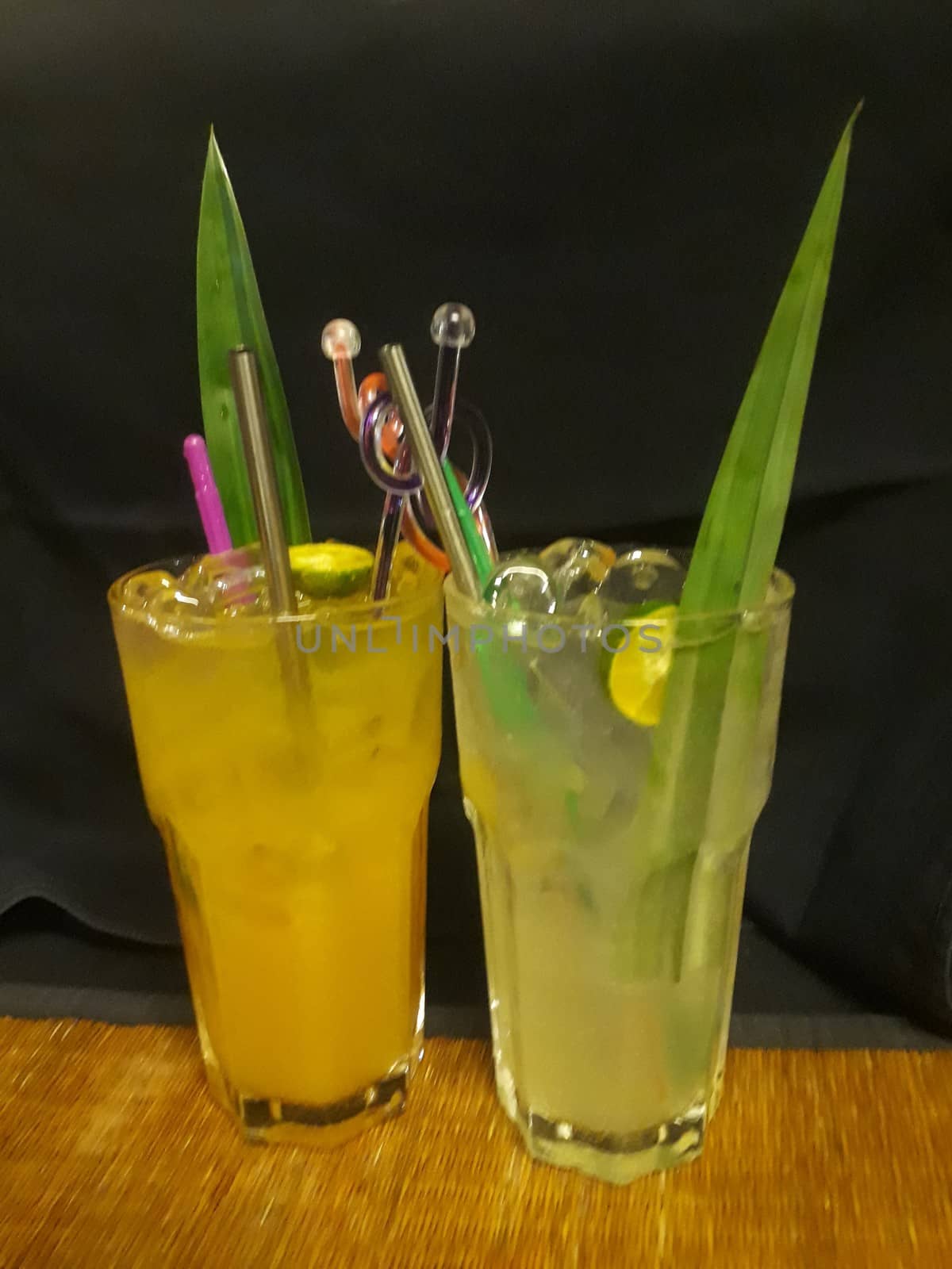 glasses of cocktails green and yellow drinks with alcohol