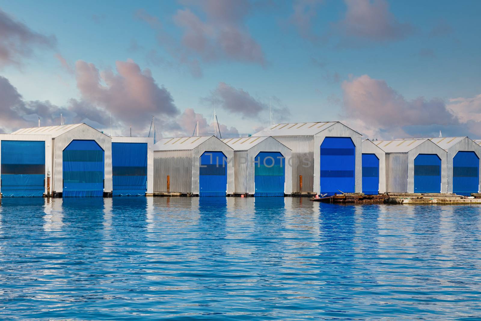 Boat Houses with Blue Doors on Blue Water