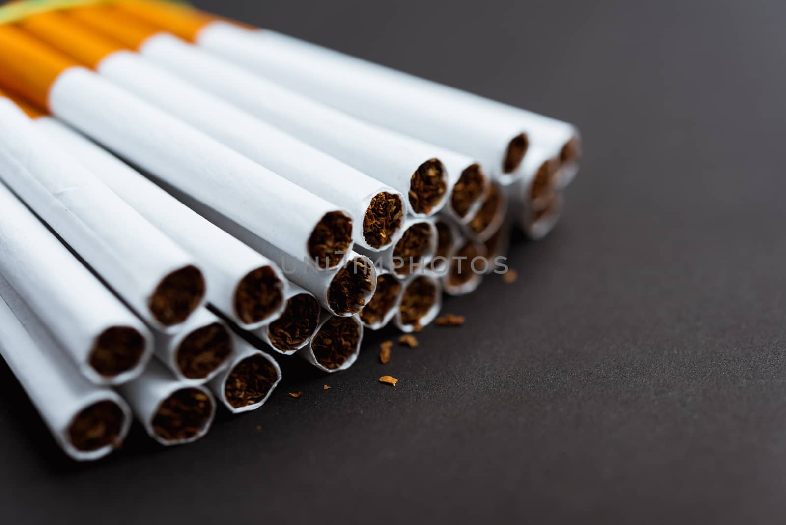 31 May of World No Tobacco Day, Close up front stack pile cigarette or tobacco on black background with copy space, Warning lung health concept