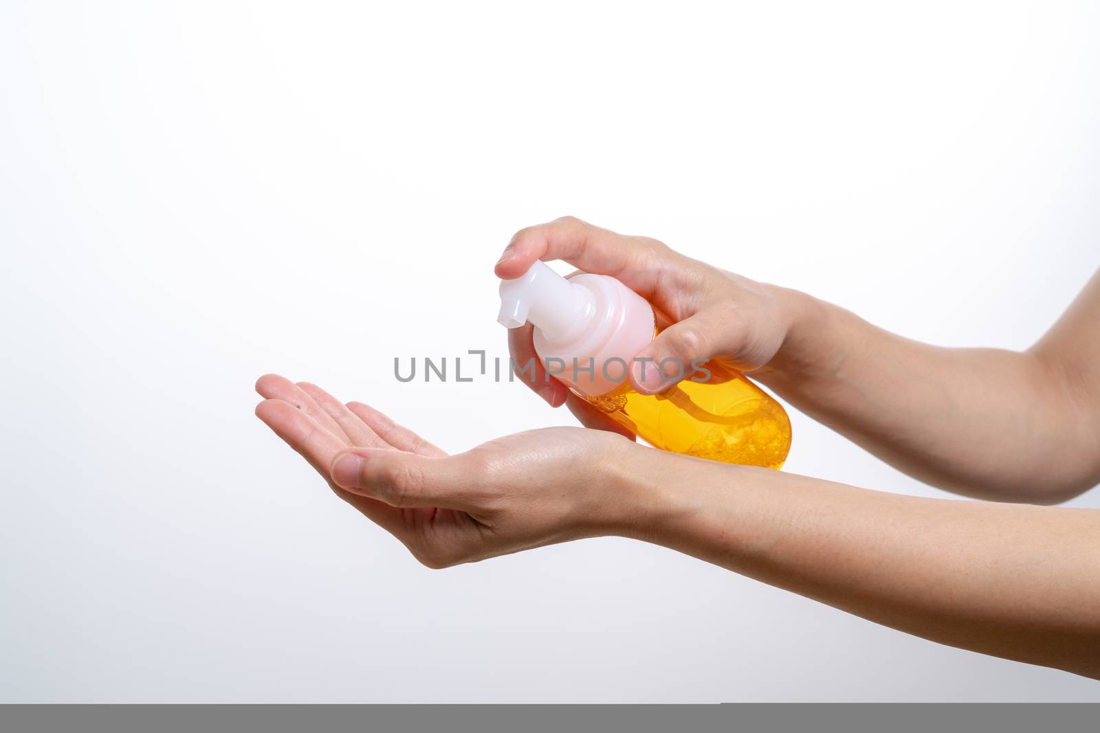 cleansing wash essence, skin care. women hands holding cleansing bottle, beauty and body care concept