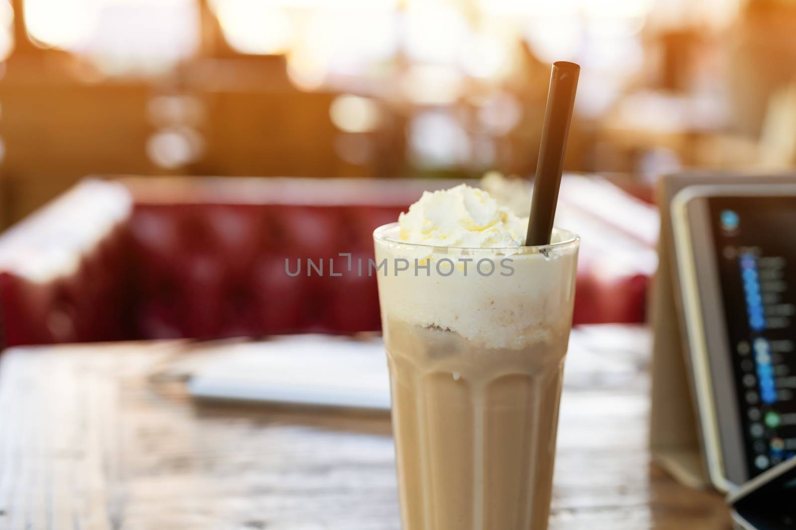 ice mocha coffee on wooden table smart computer pad