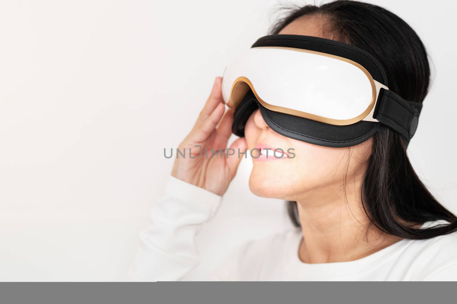 relax and massage, electric eye massage machine on women, closeup, healthcare and medicine concept